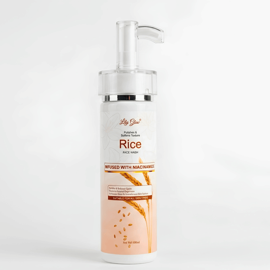 A bottle of Lily Glow Rice Purity Wash with a clear pump dispenser, featuring a white and peach label with illustrations of rice grains.